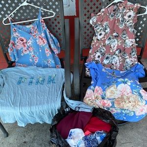 It’s a bag of blouses,shirts and dresses.